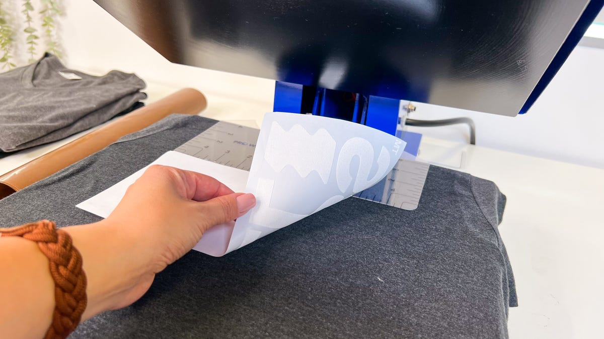 Place the heat transfer design with the carrier side up on the t-shirt