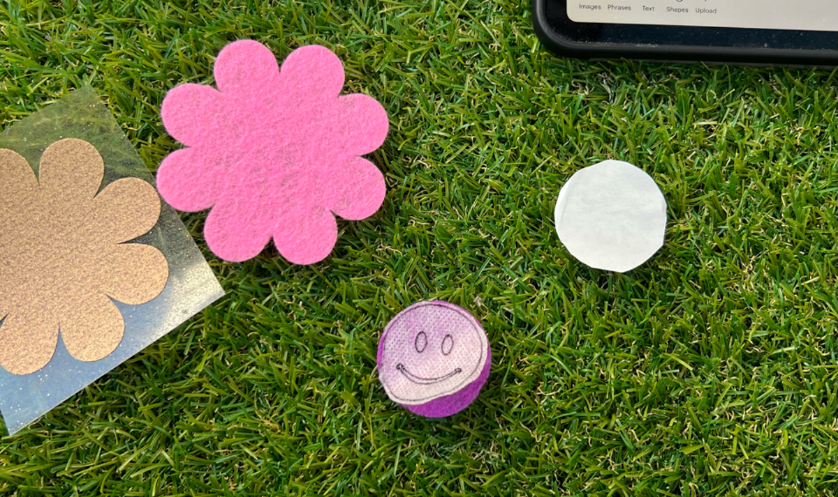 Attaching the design onto the felt layer cut to the size of the design.