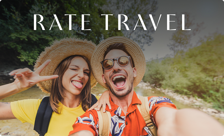 Couple on vacation taking a selfie, promoting Rate Travel.