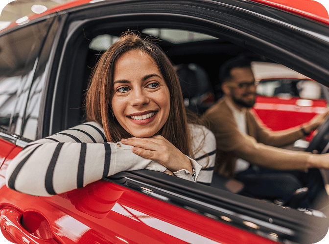 Woman leaning out of a car window