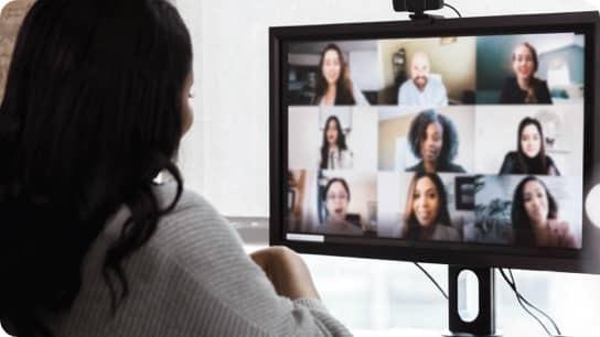 A remote employee participates in an online meeting with coworkers.