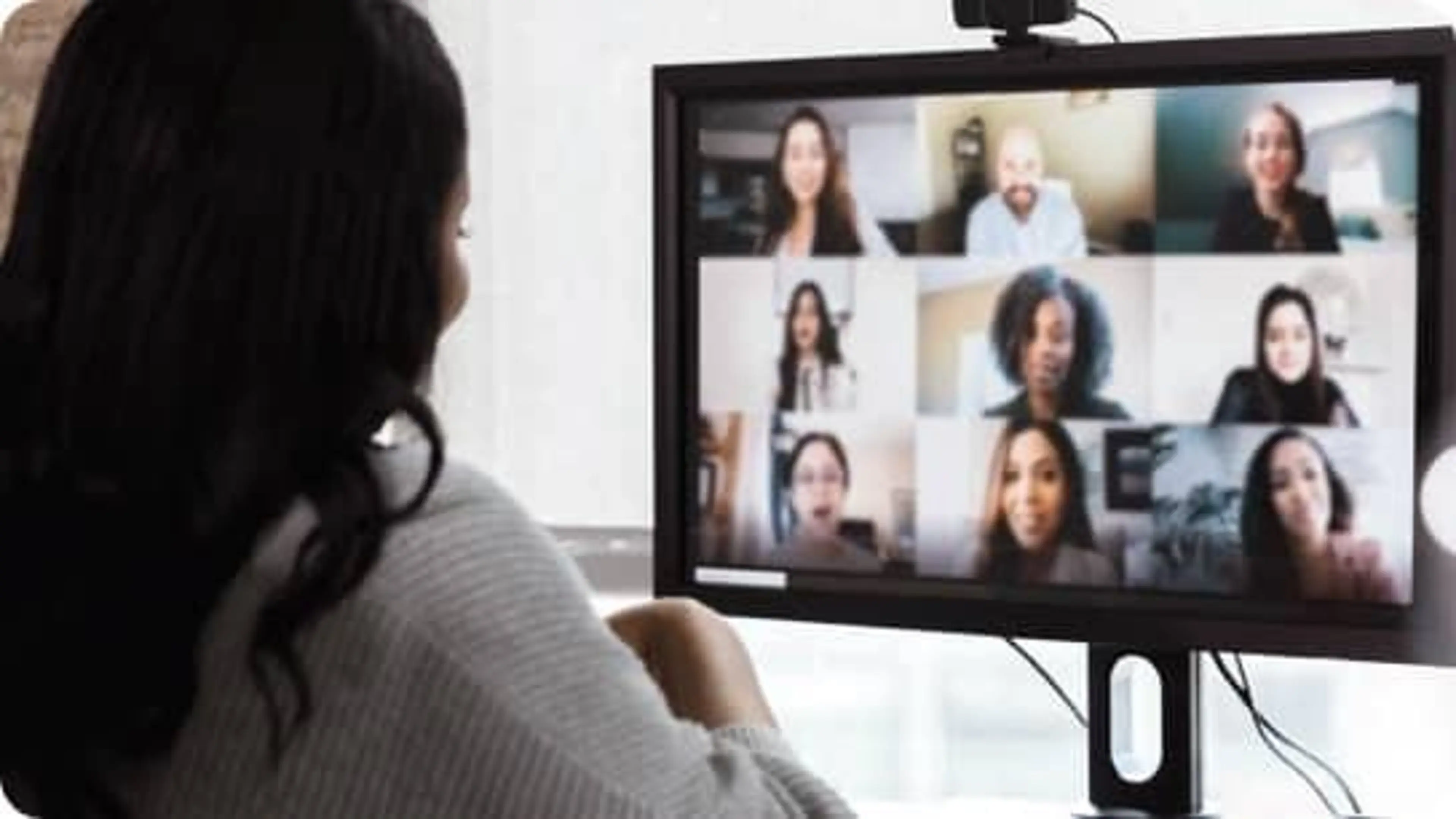 A remote employee participates in an online meeting with coworkers.