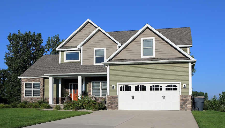 Two-story home with a garage and driveway.