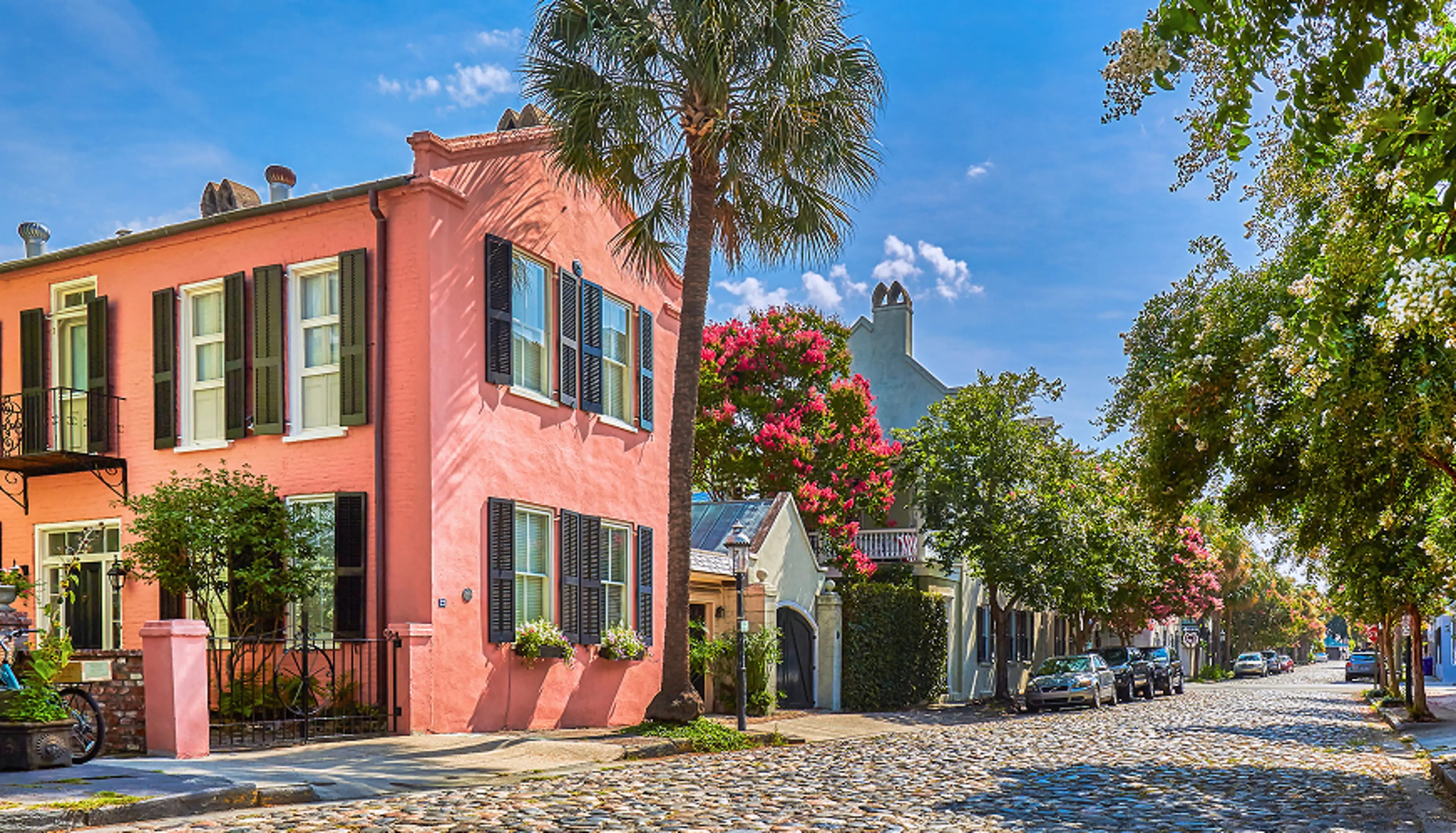 Homes along the side of a cobblestone road.