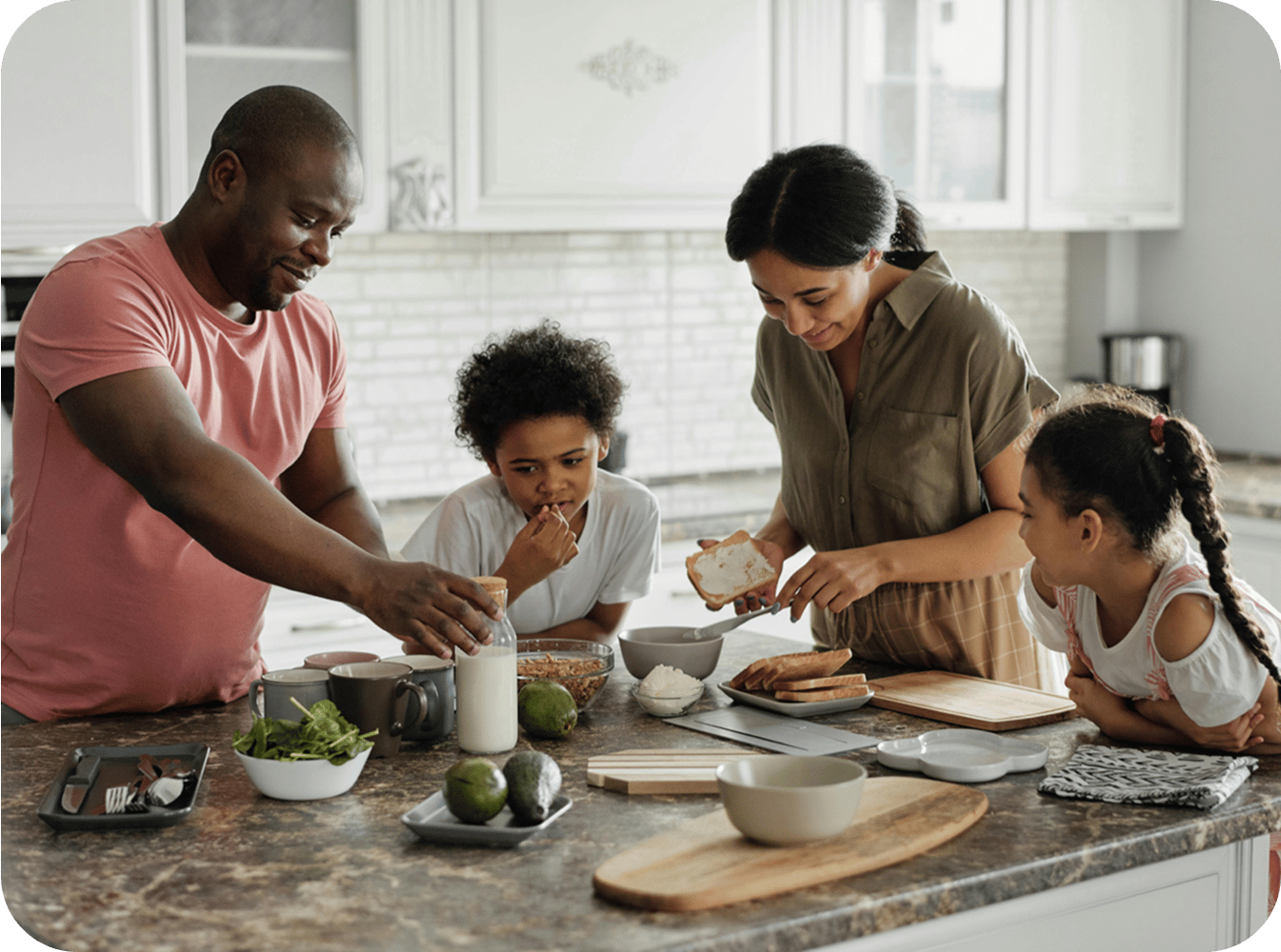 Family in the kitchen eating toast