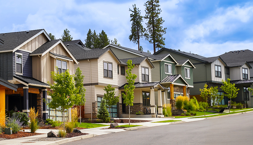 Townhomes on the side of a street.