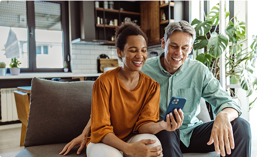 Couple smiling at phone