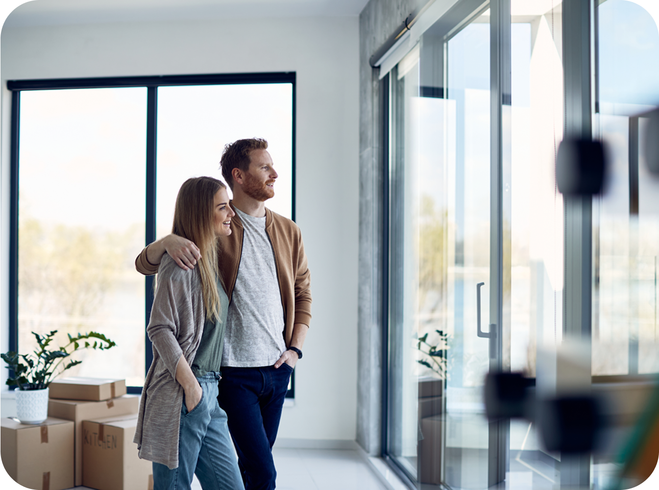 Couple looking out of a scenic sliding door