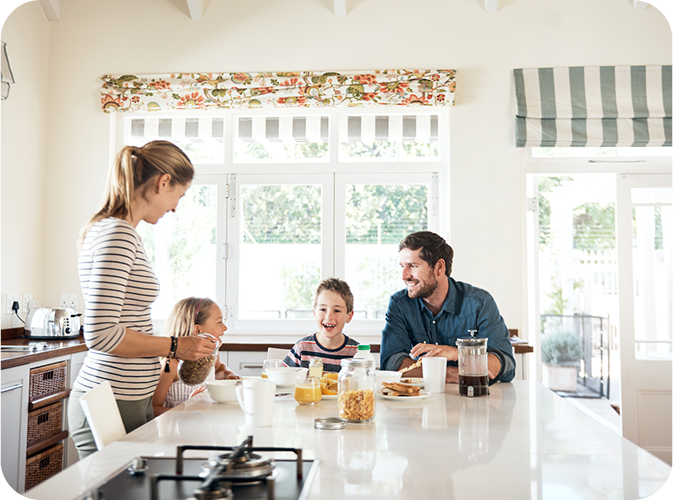 Family at kitchen island table