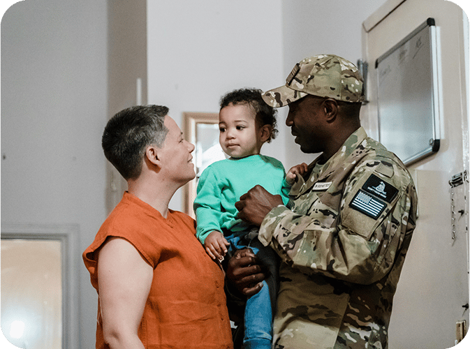 Soldier holding baby