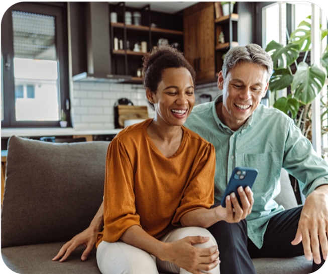 Couple on the couch on their phone