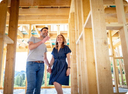 Homeowners looking at their home under construction