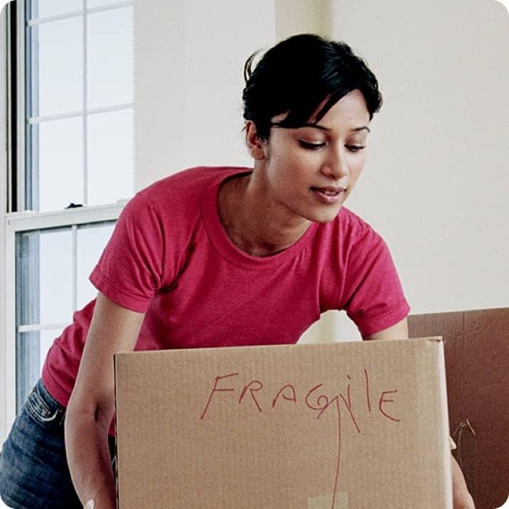 A person lifting a box.