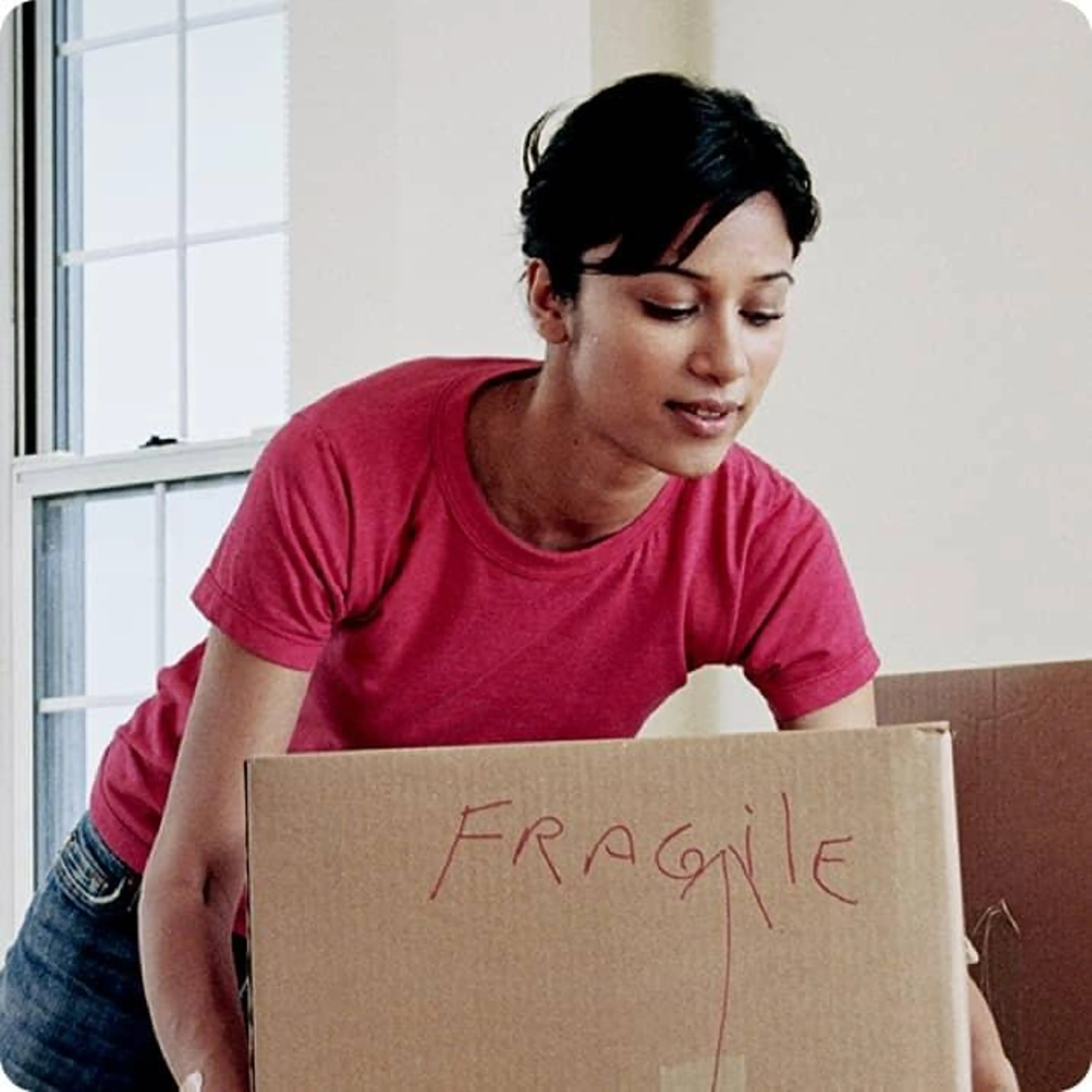 A person lifting a box.