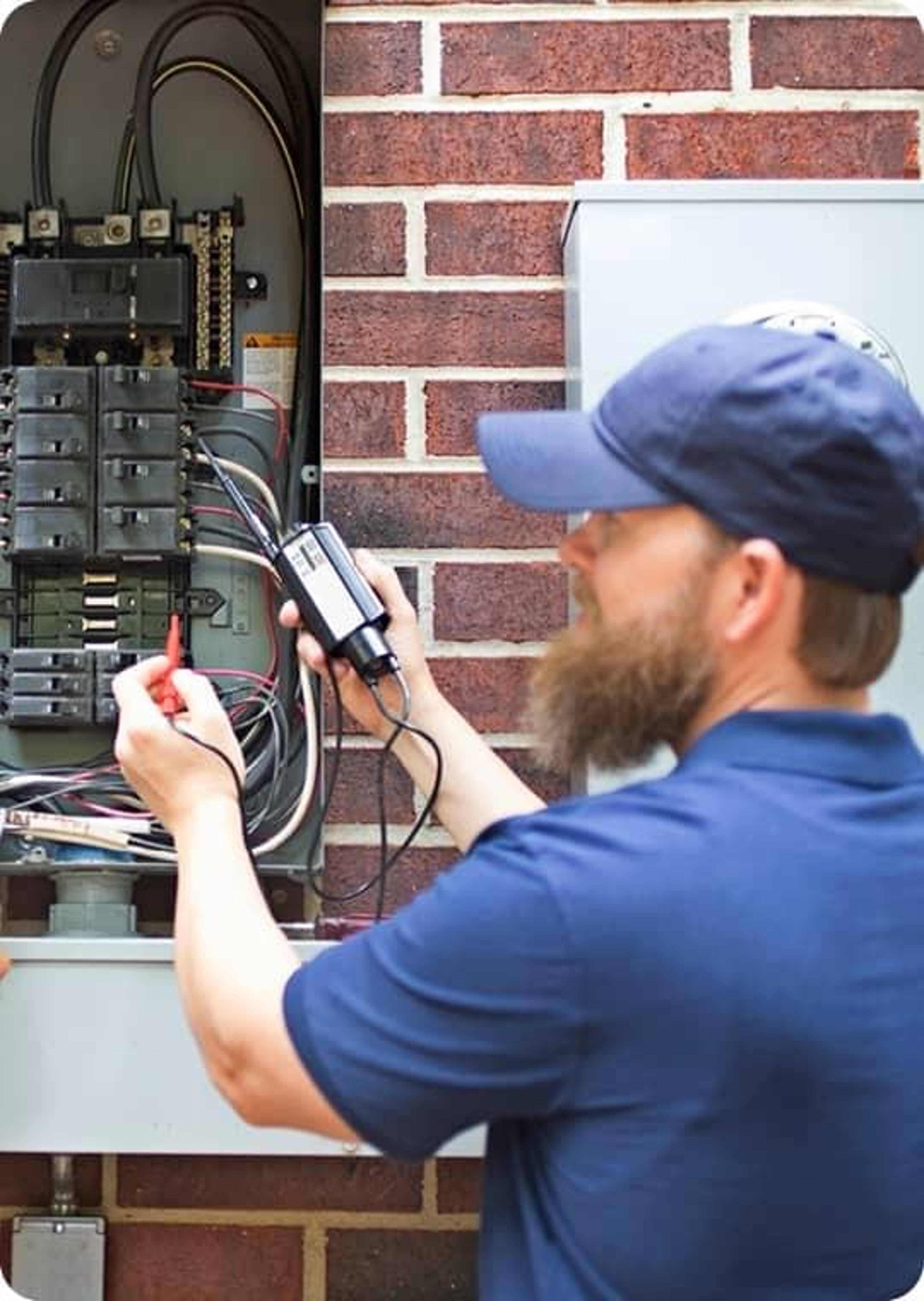 Utility man checking electrical panel