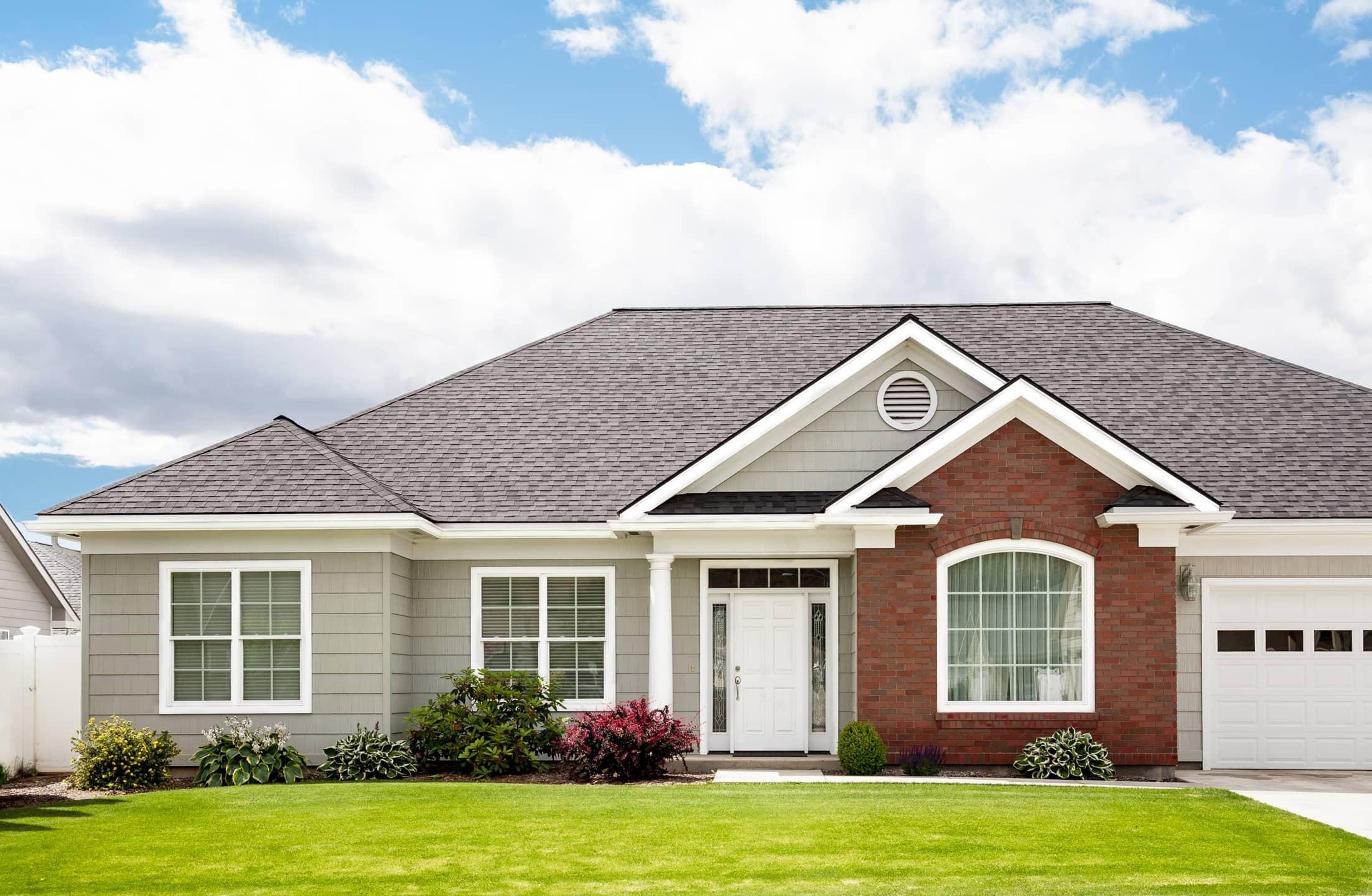 Single-story home with a front lawn.