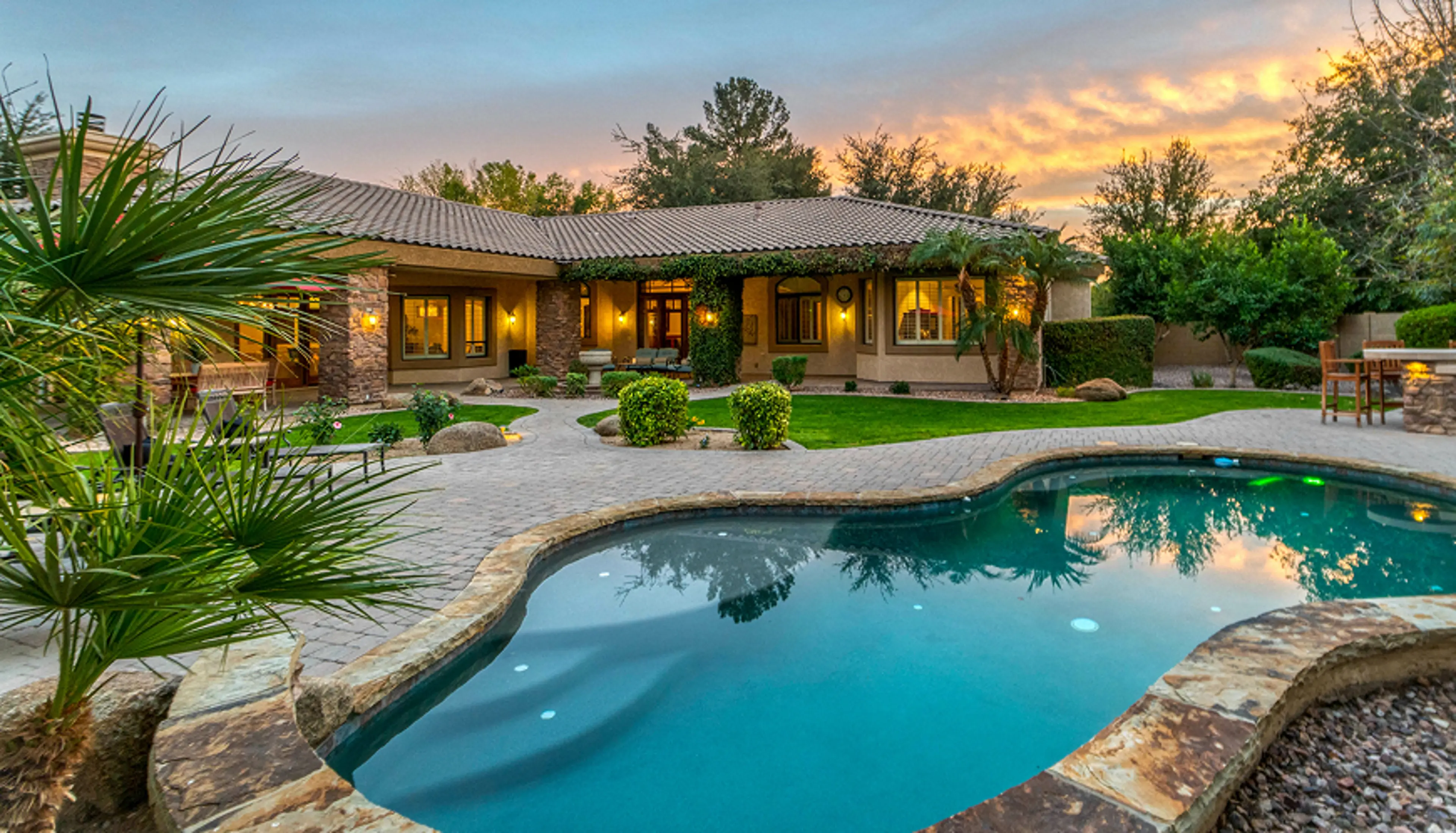 A home with a pool in the backyard.