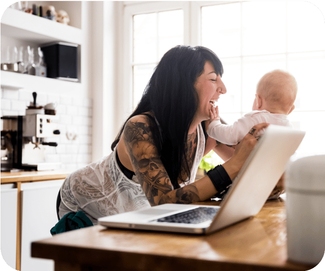 Woman holding baby on counter