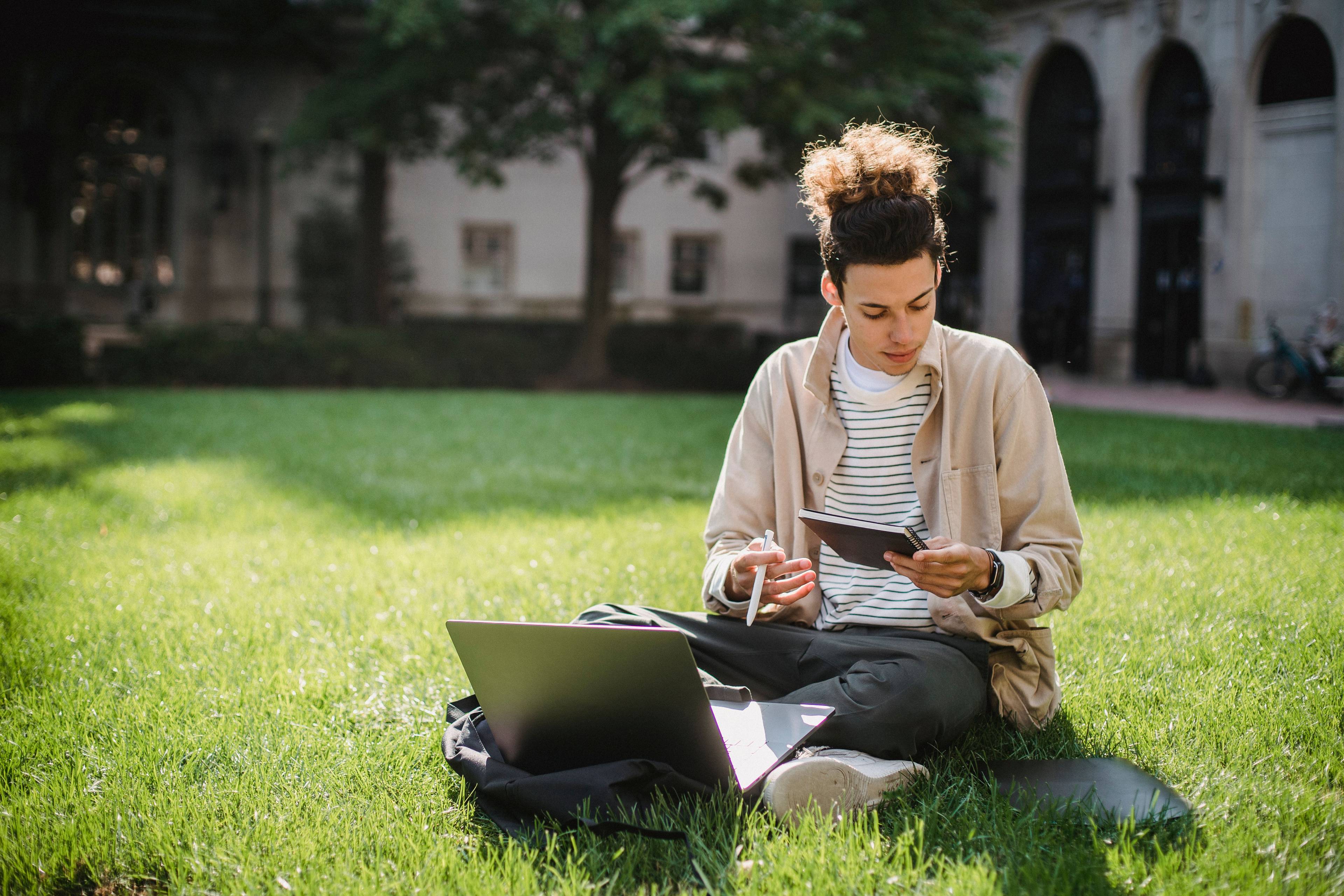 Student reviewing federal and private loan options on campus