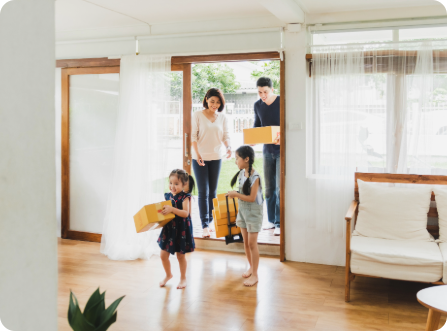 Family enters doorway of house
