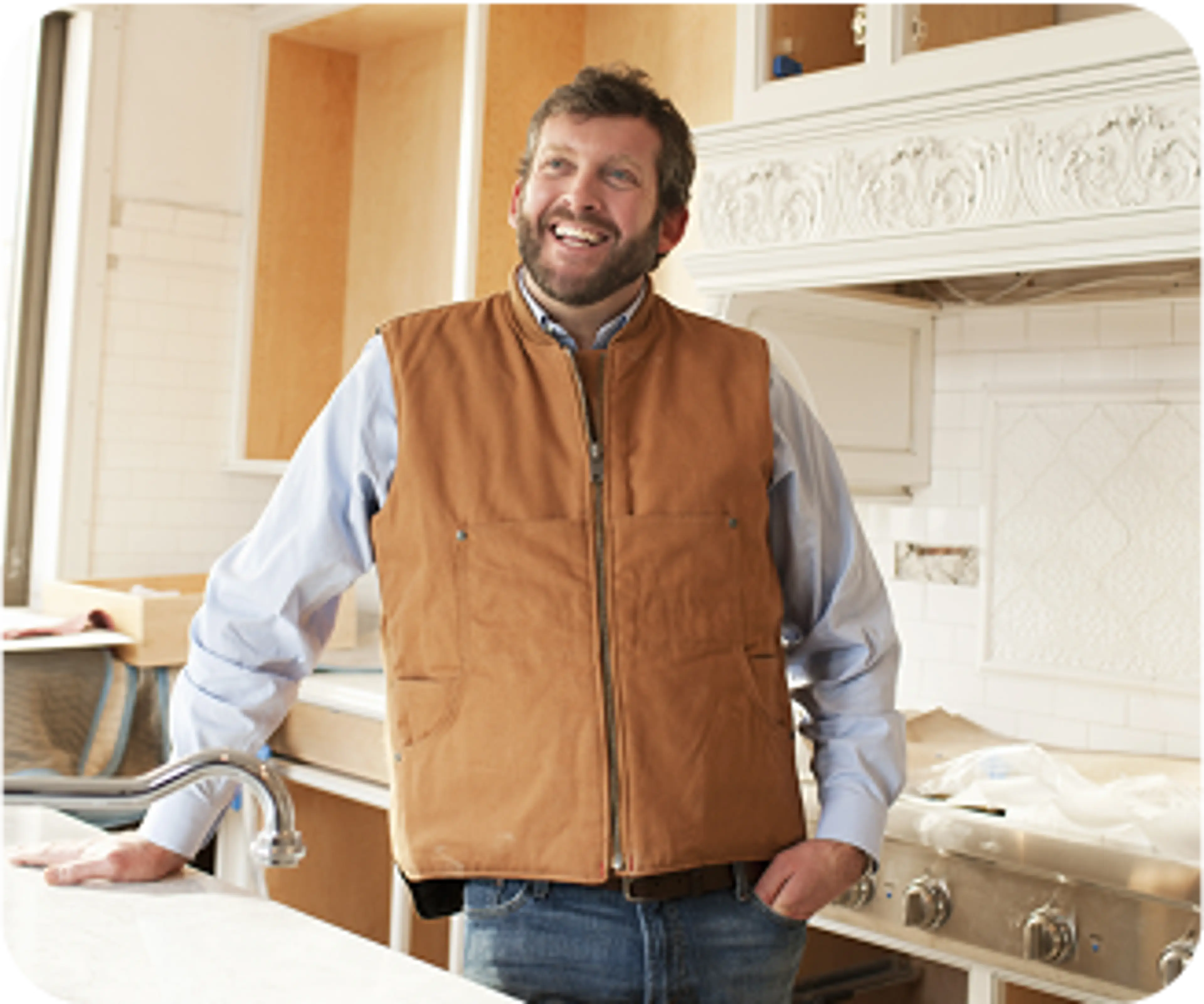 Man standing in a renovated kitchen