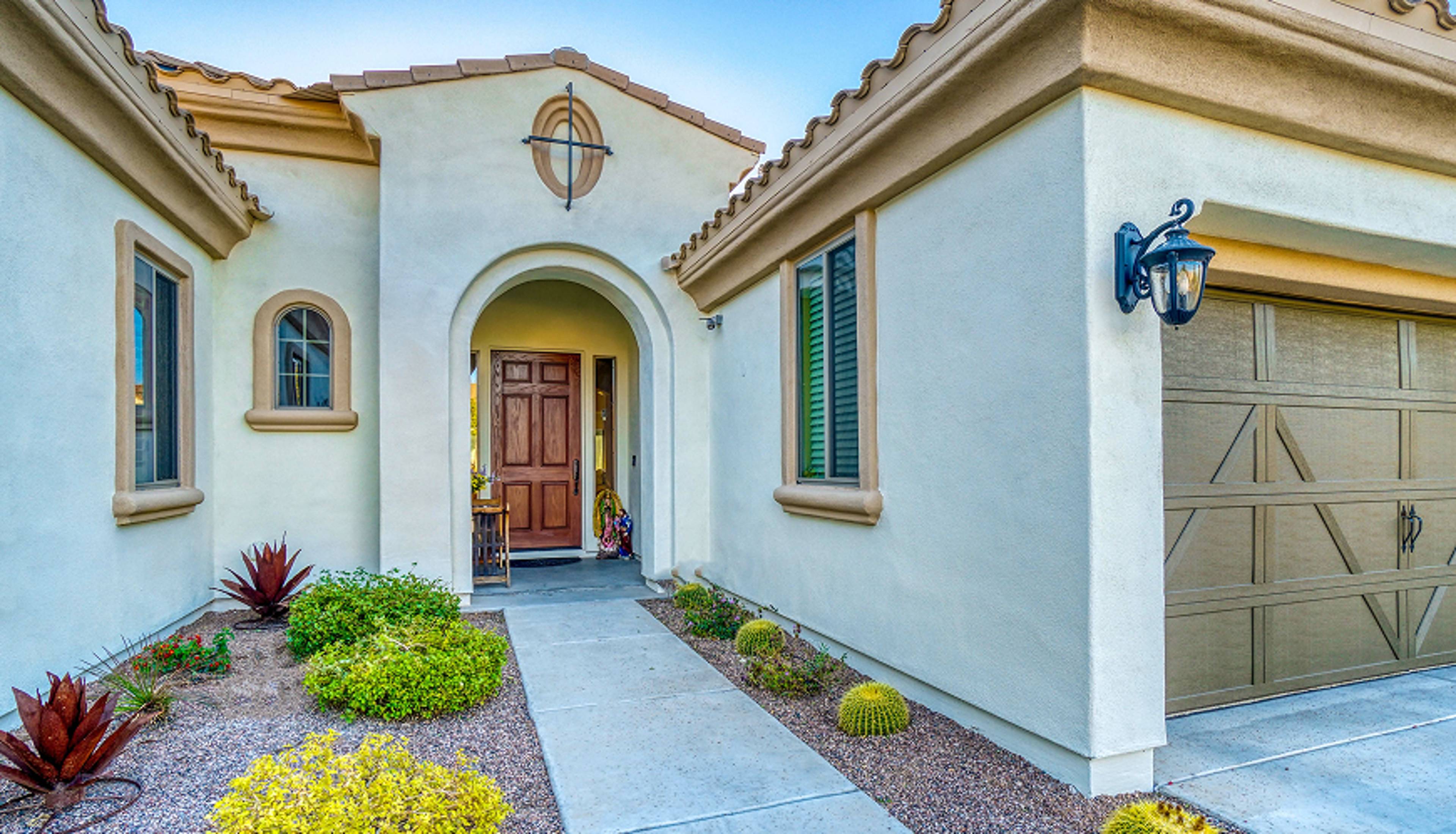 A walking path to the front door of a home.
