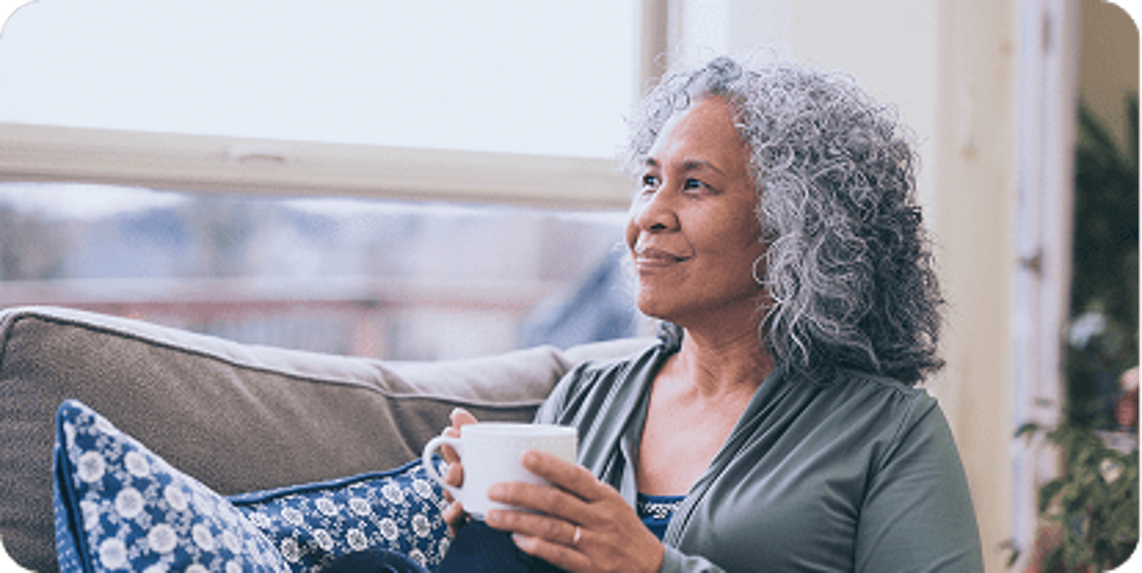A woman enjoying a cup of coffee