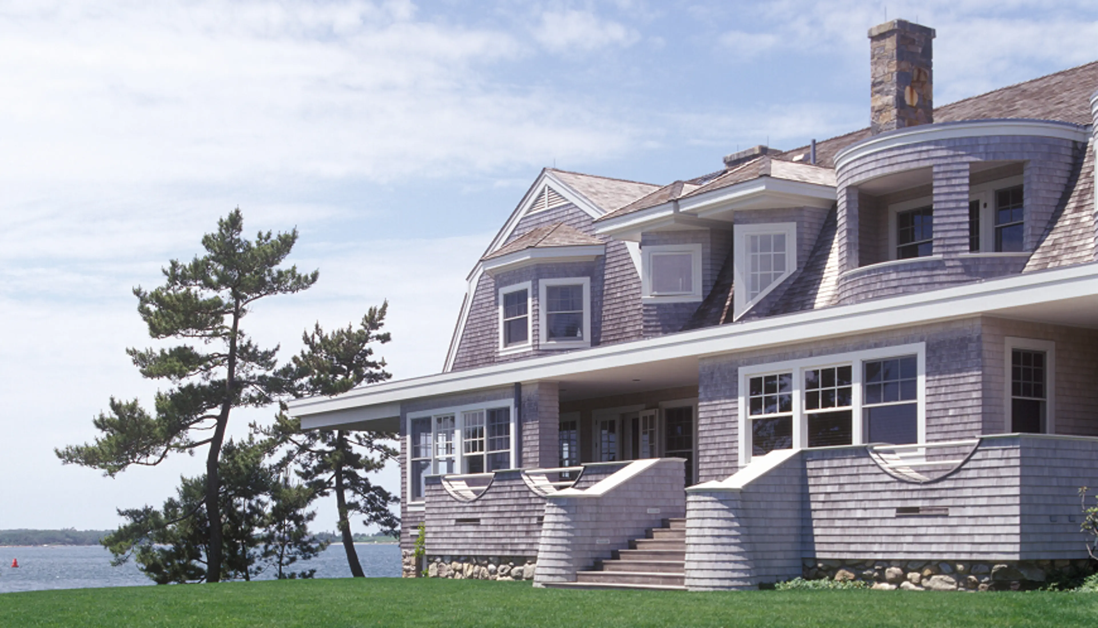 View of a house from the front yard with green grass.