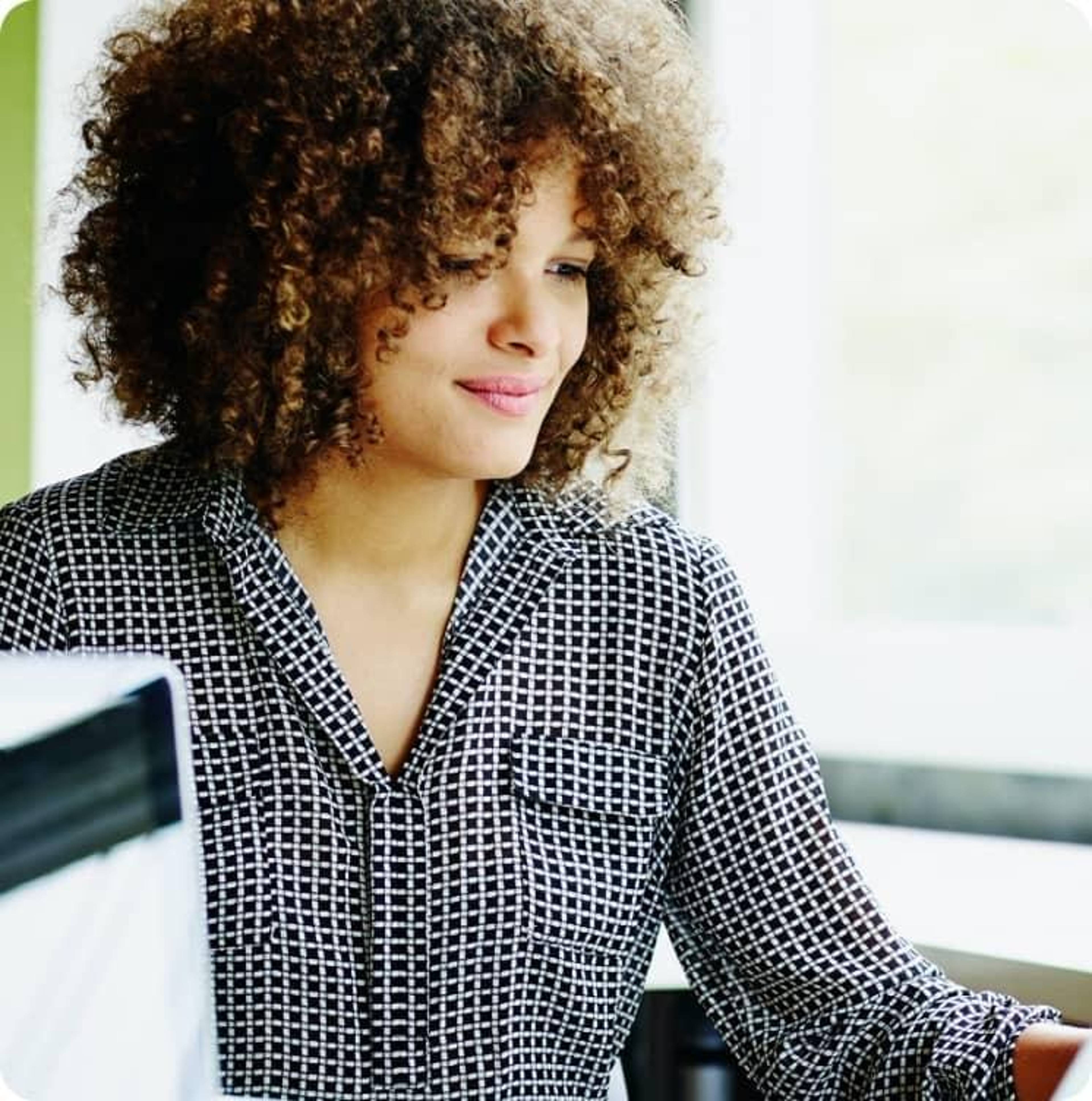 A Rate employee working at their desk.