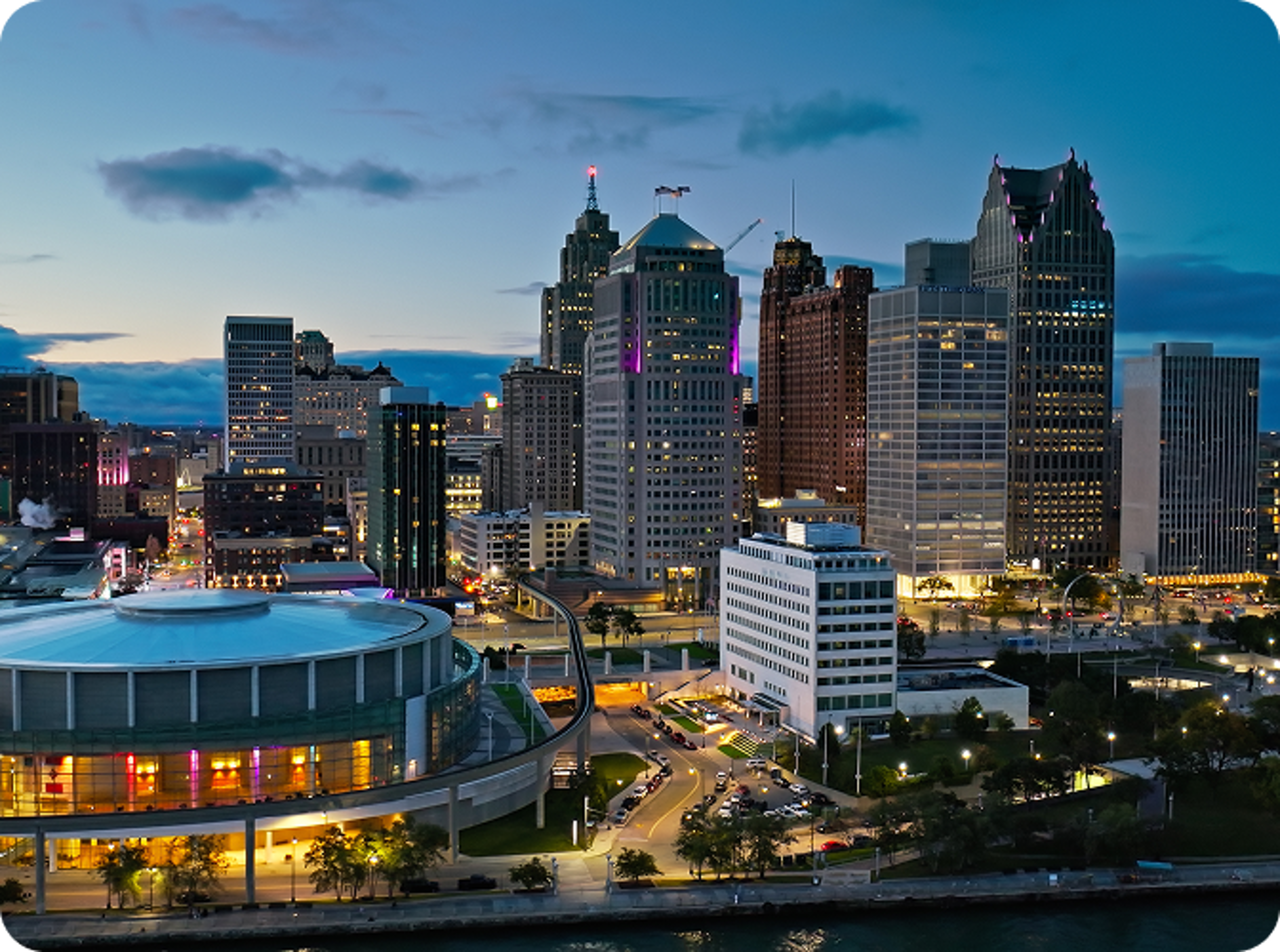 Downtown Michigan buildings at night from a view above.
