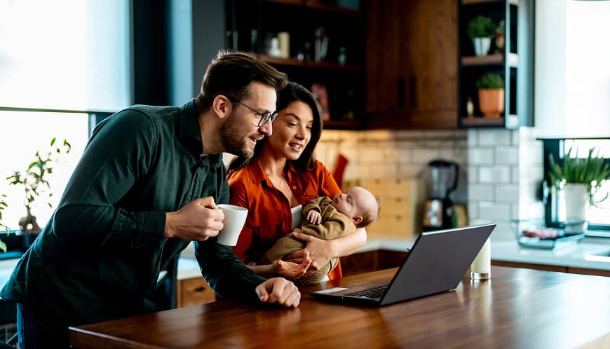 Couple filling out a digital mortgage on a computer