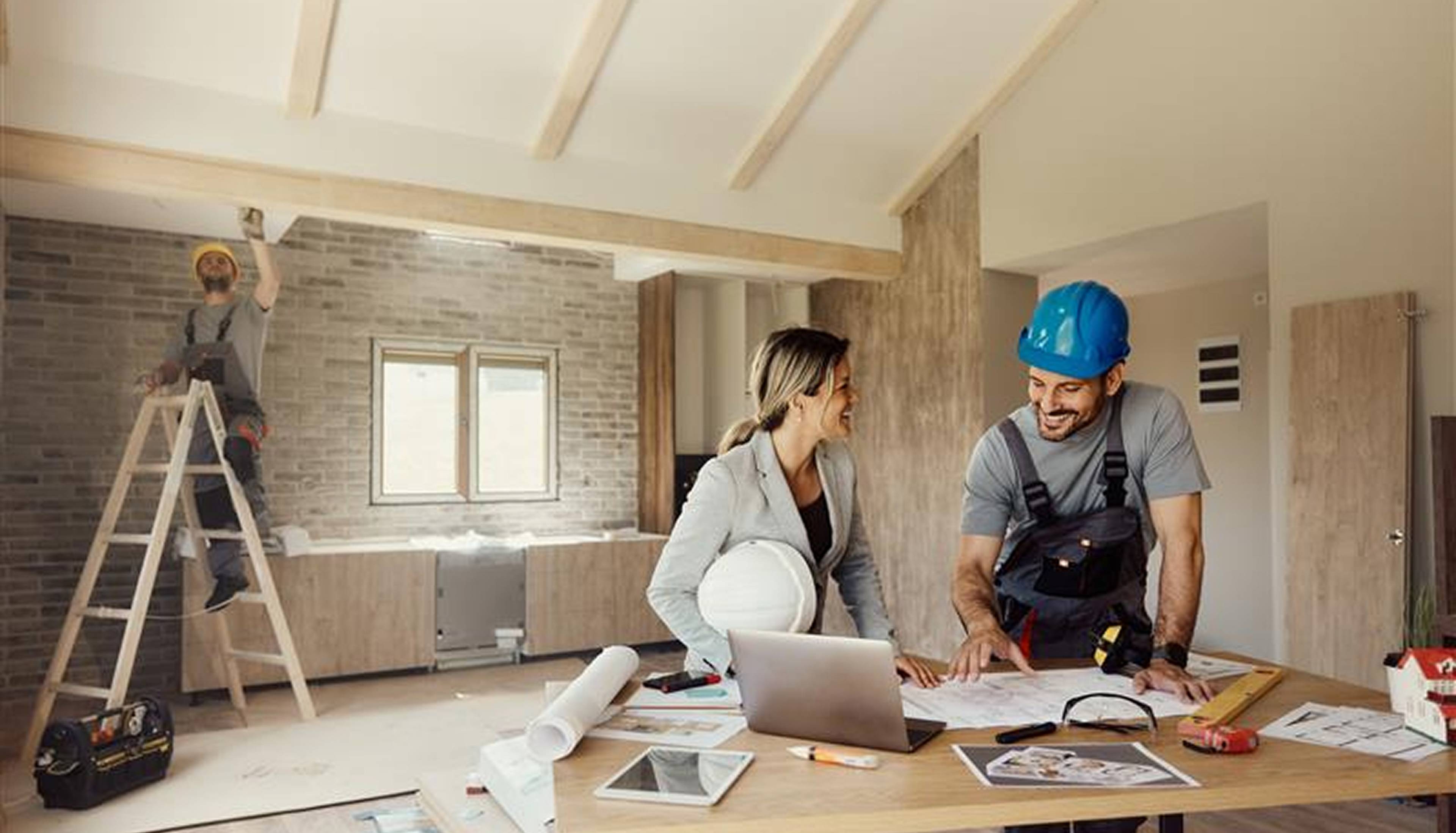 Woman and man doing home renovation.