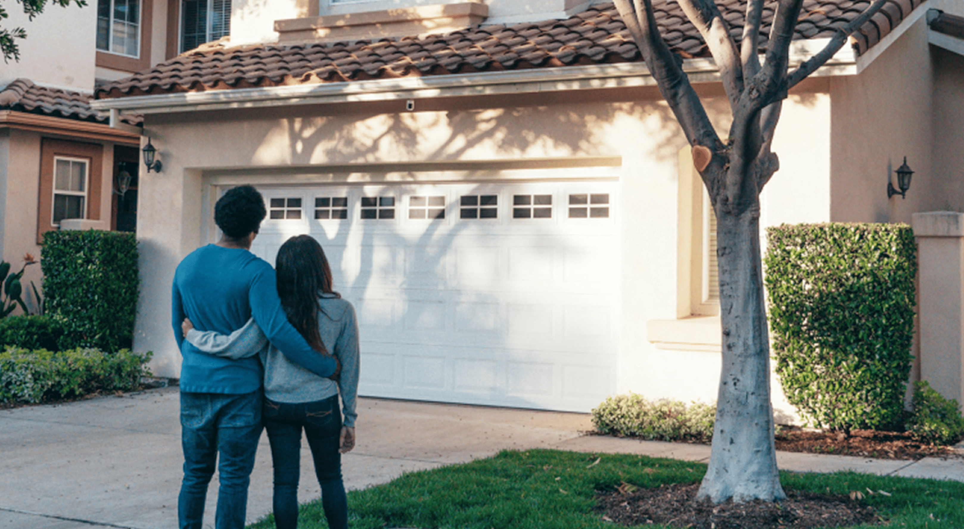 Couple outside house