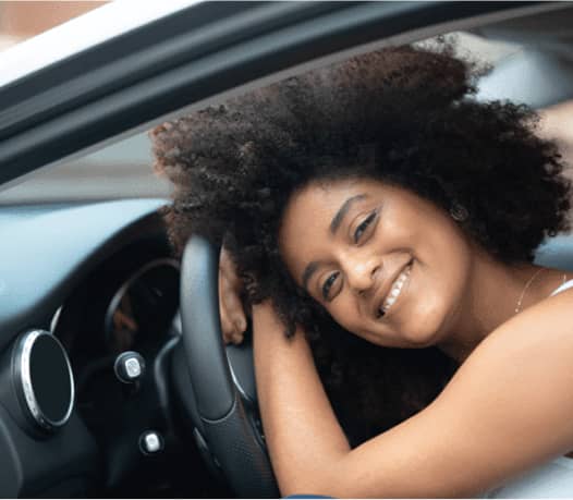 Girl leaning on steering wheel