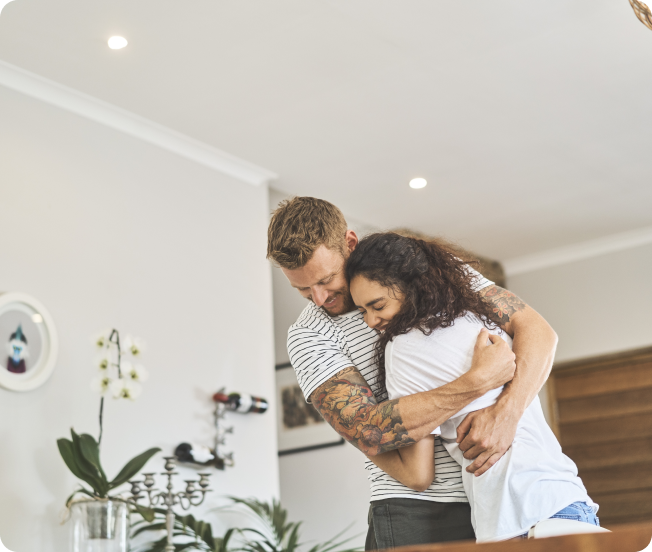 Man and woman hugging and smiling