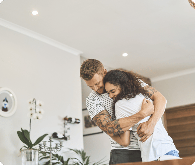 Man and woman hugging and smiling