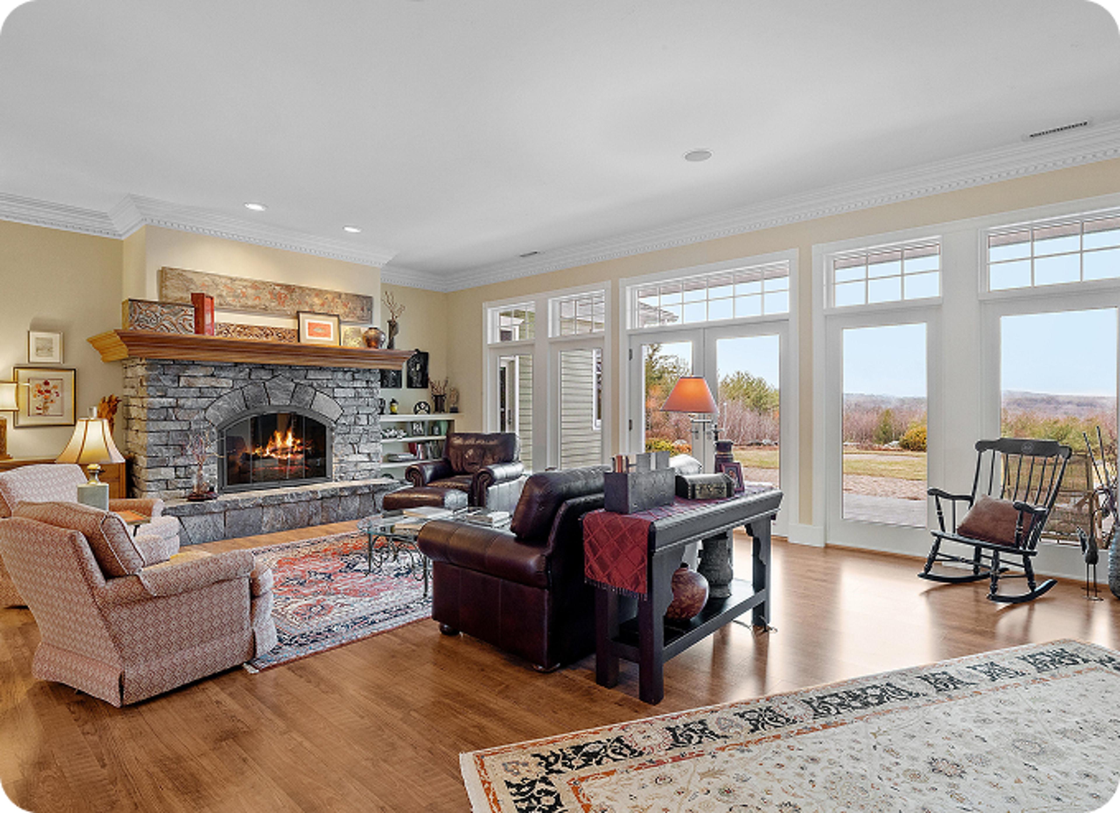 A warm and inviting living room in a North Carolina home featuring a beautifully lit fireplace, comfortable furnishings, and a cozy atmosphere perfect for relaxing or gathering with family and friends.