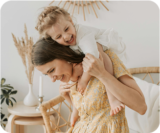 Woman with child on her shoulders