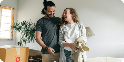 Couple laughing together in their home