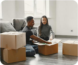 Couple unpacking several boxes
