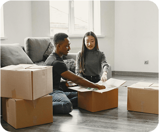 Couple unpacking several boxes