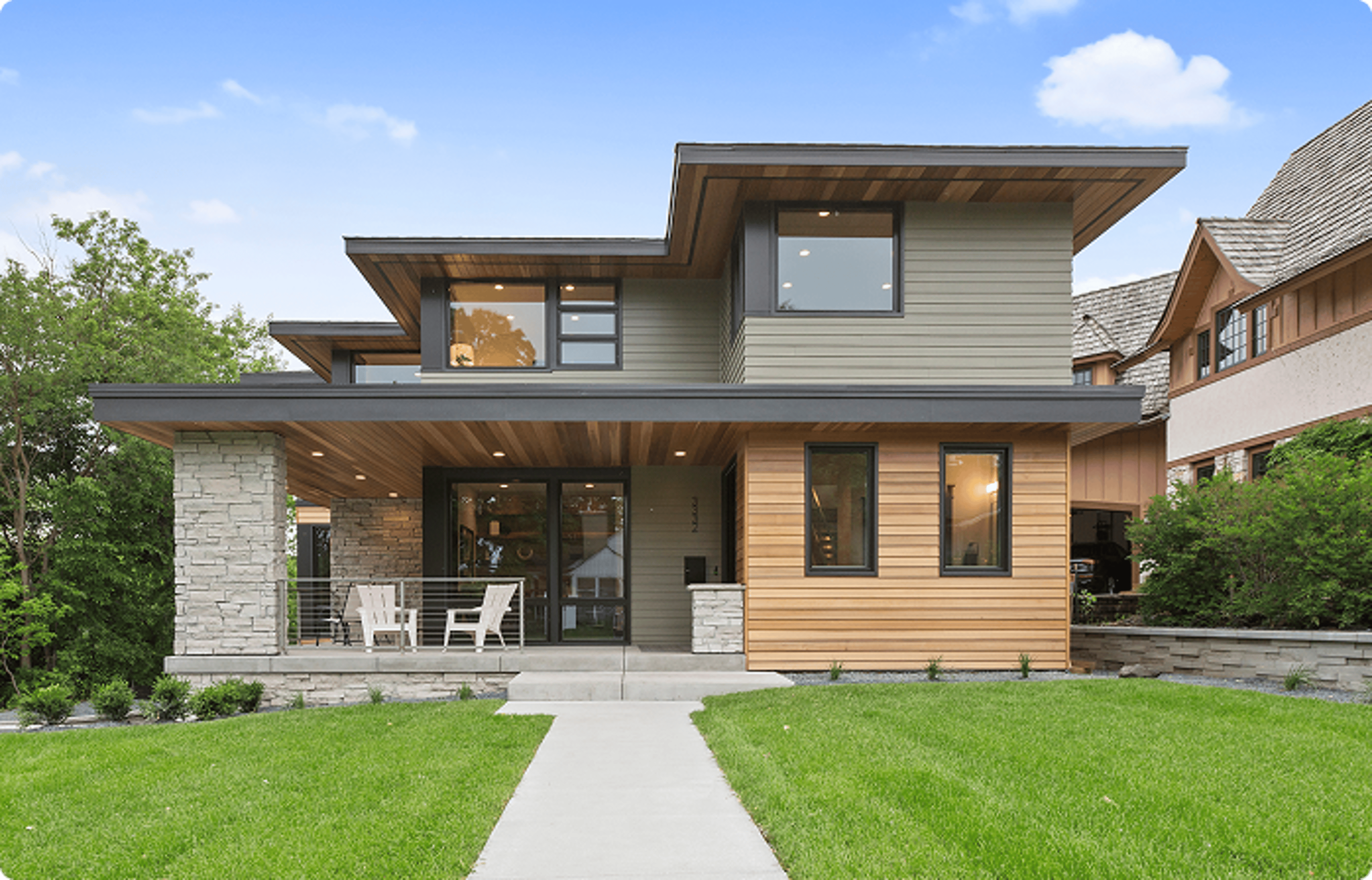 CashReady - Two story house with grass.