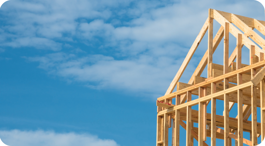 Wooden house frame with the sky in the background