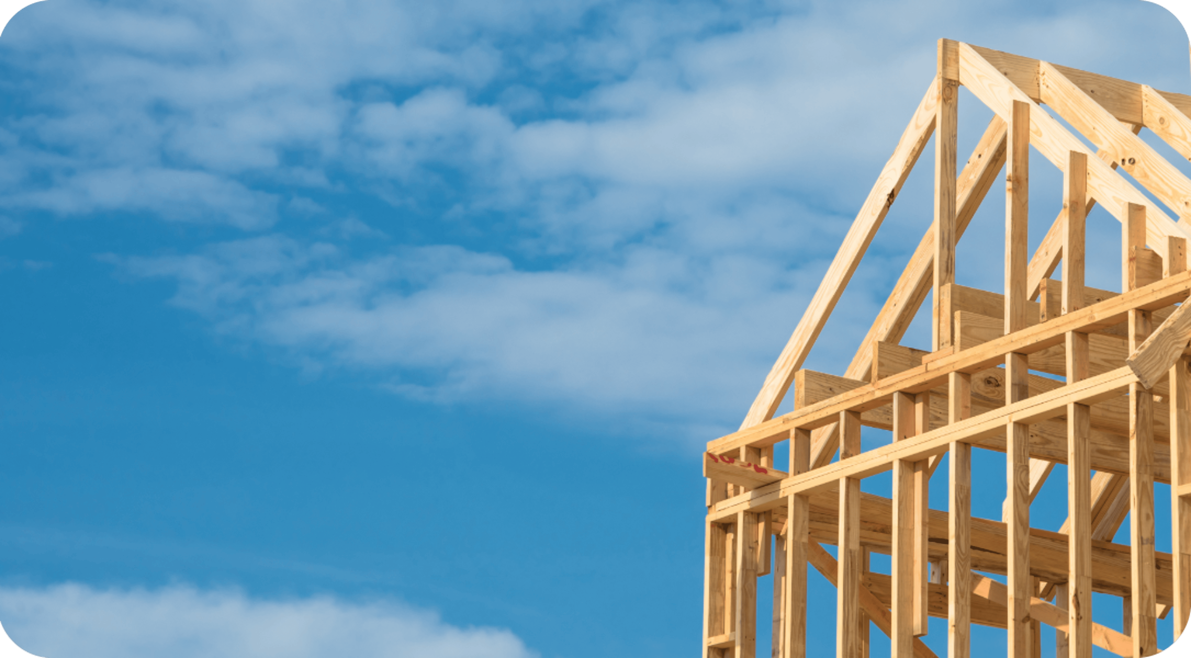 Wooden house frame with the sky in the background