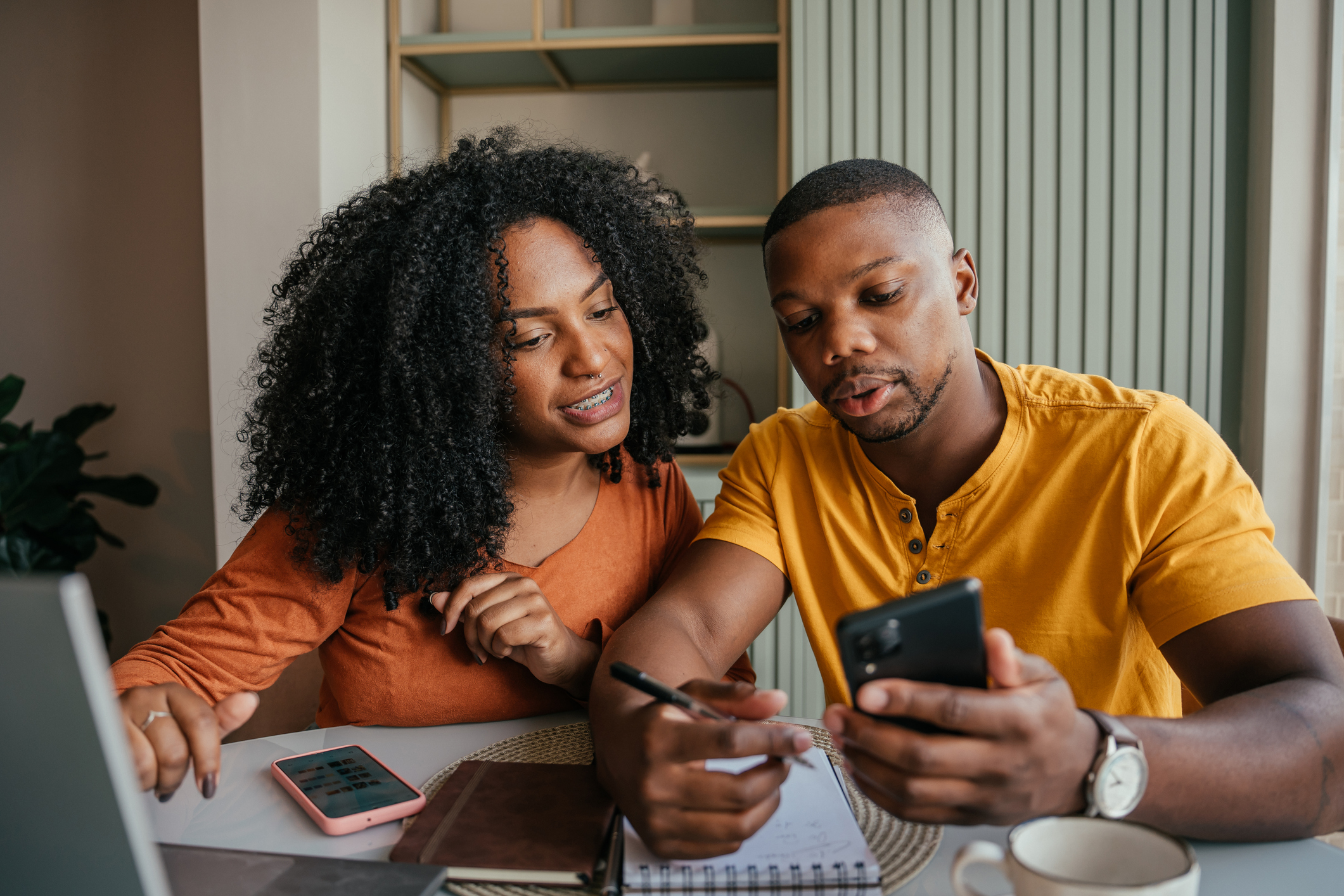 A couple budgeting their finances.