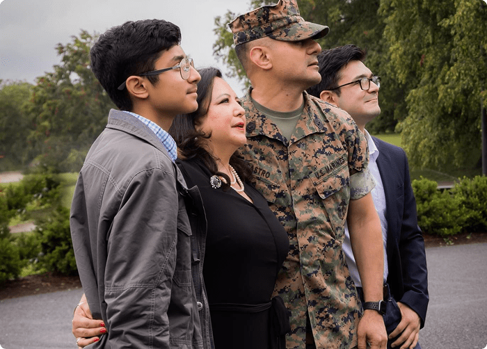 Soldier with family hugging