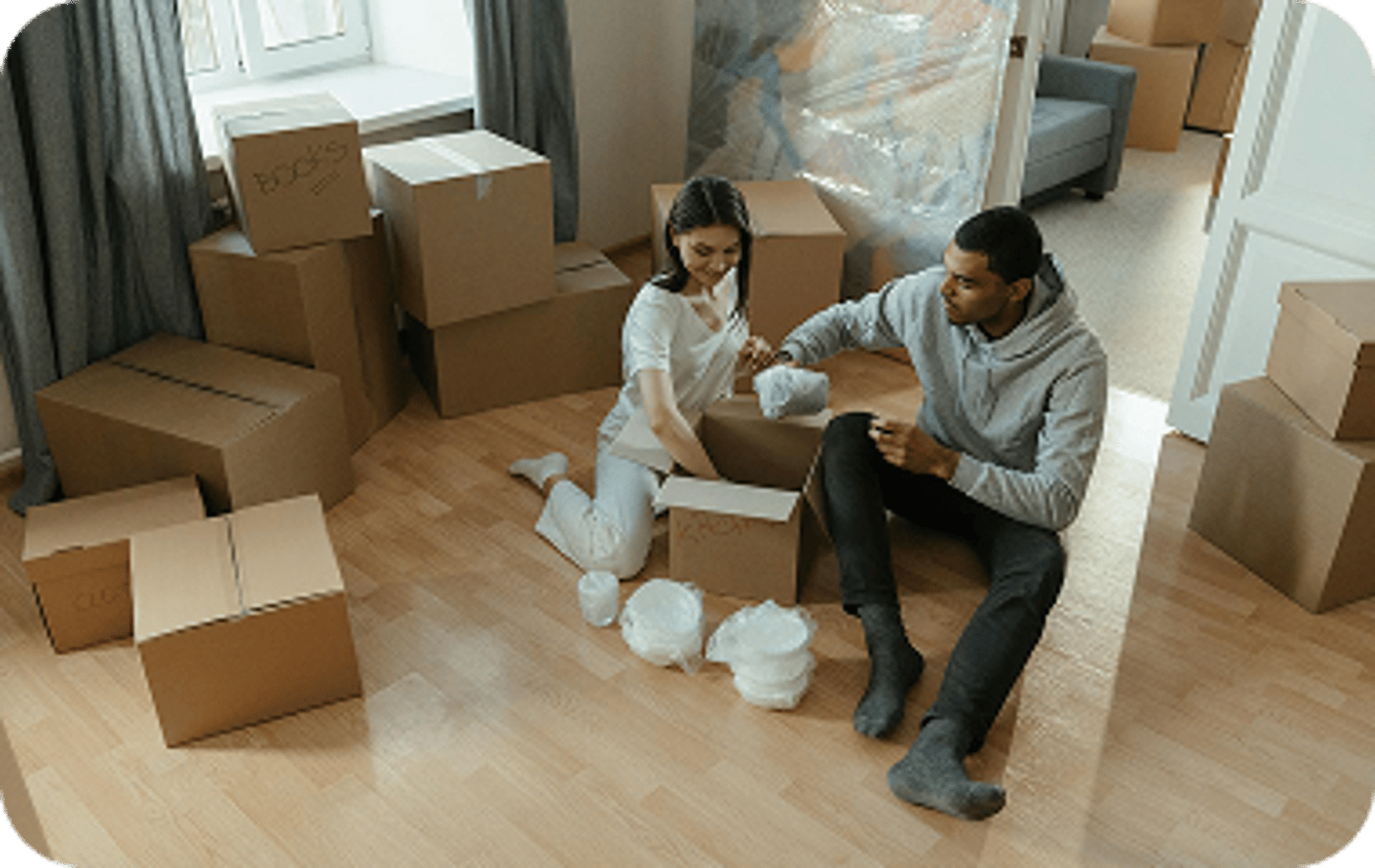150 Cubs facts - Home loans - Couple unpacking boxes.