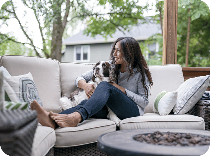 Woman on couch with her dog