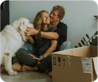 Couple and dog sitting on the floow