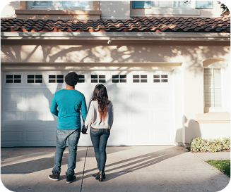 Couple looking at their garage